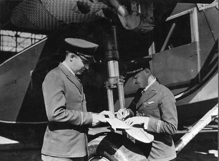 Morehouse (L) and Parker Flight Planning on a Fender, Ca. 1929 (Source: Woodling) 