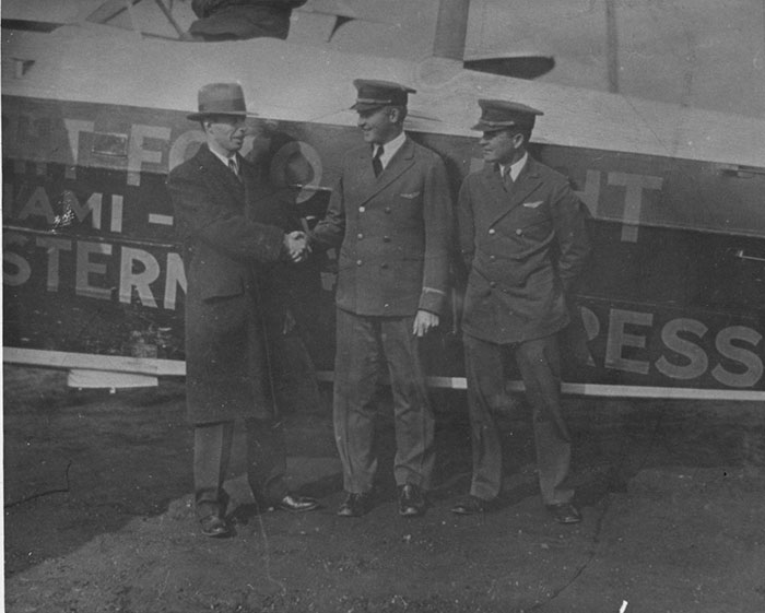 Silas Morehouse (C) and Two Others in Front of Fokker NC331N (Source: Woodling)