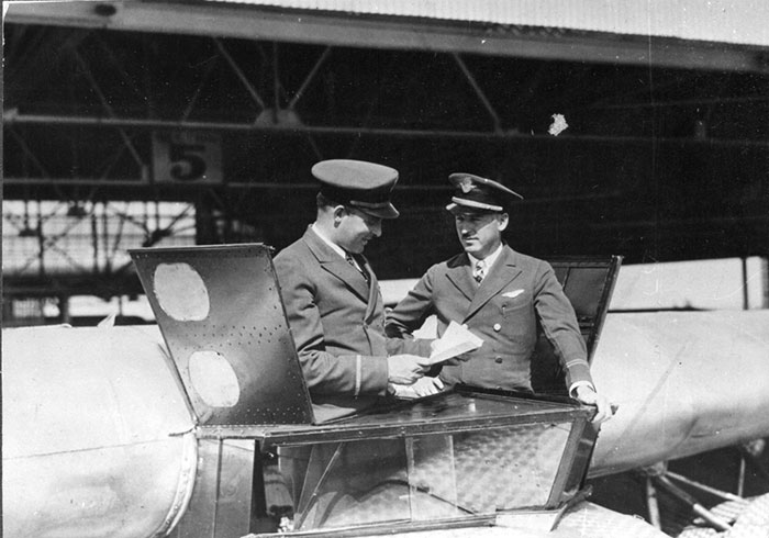 Morehouse (L) and Parker Standing in Cockpit, Ca. 1929 (Source: Woodling) 