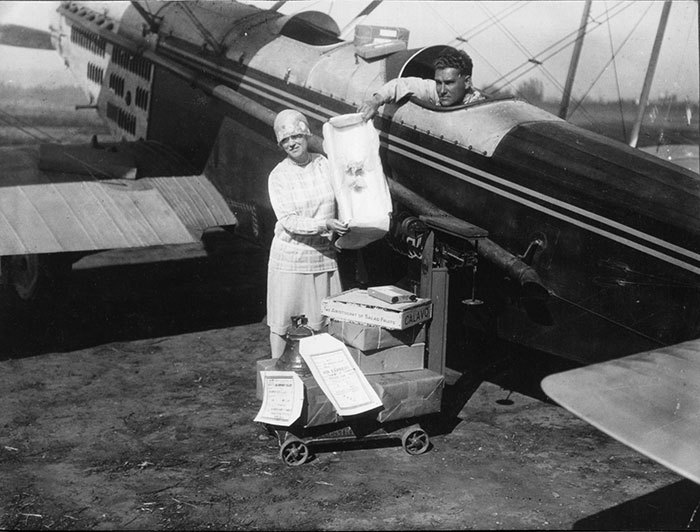 WAE Douglas Airplane Taking Mail Aboard, Ca. Late 1920s (Source: Woodling)